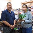 Isaac Vega and a volunteer at the Claremont Satellite Food Pantry.