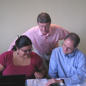Ecologic 3 People Looking at Notebook