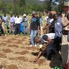 Applying organic fertilizer to conservation plot