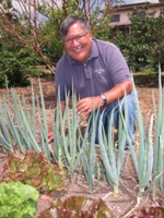 Photo of Tim Constantine in his community garden for nonprofit organizations